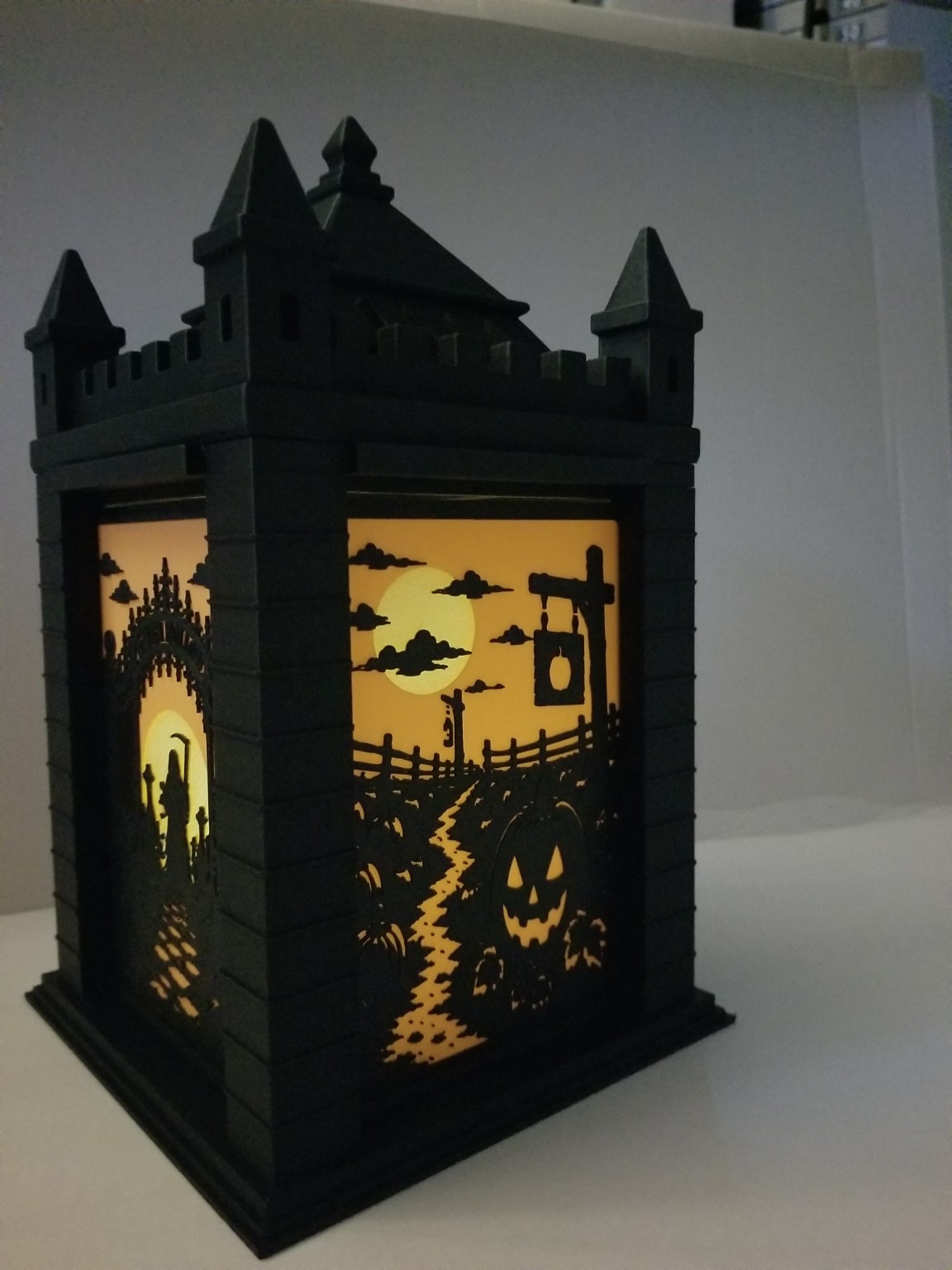 CastleGlow Halloween Lantern illuminated with interchangeable Halloween scene panels
